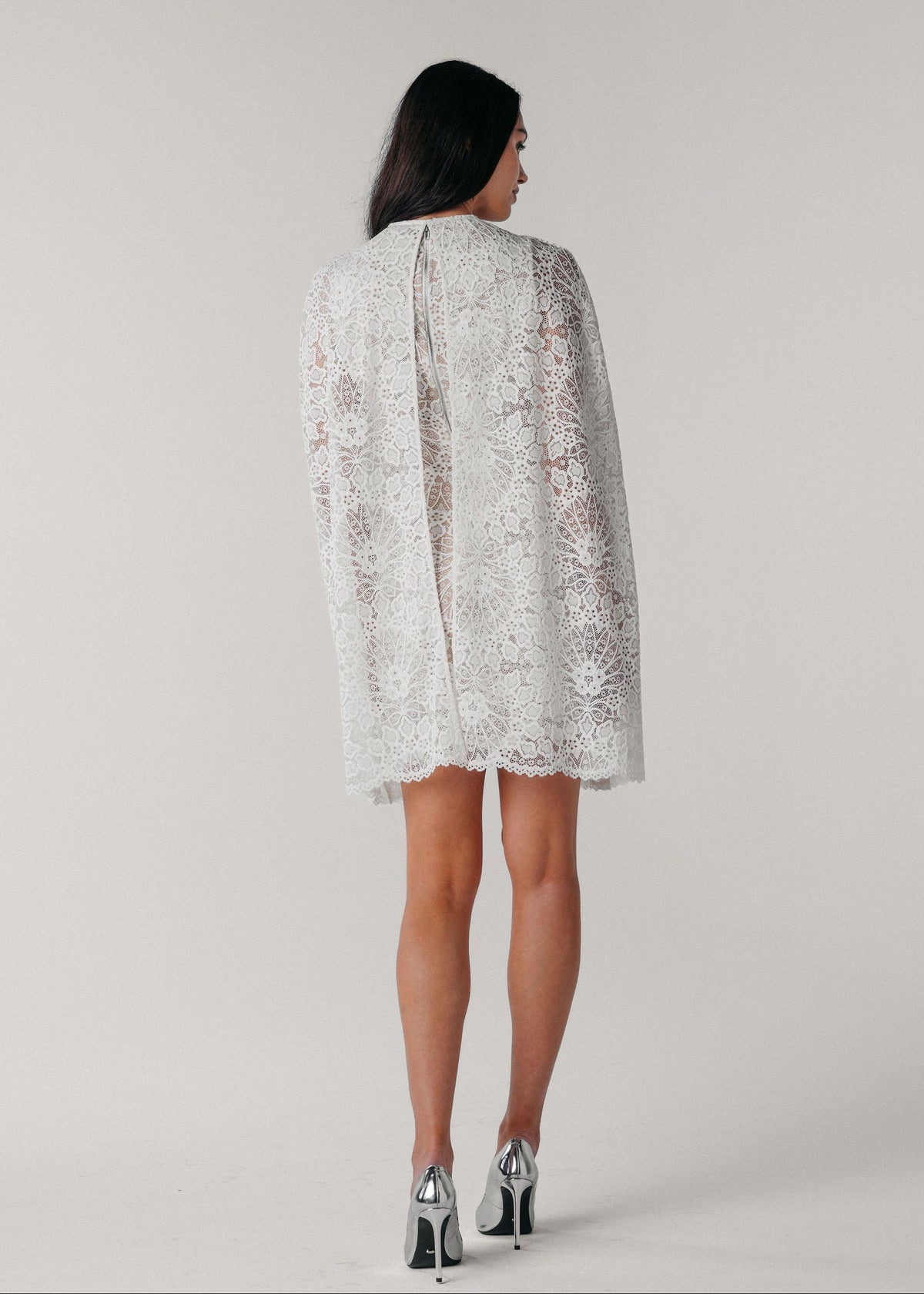 Samantha Wood Fashion Designer Bridal Era Collection Olivia V Neck Cape Dress with Signature White Lace on Model (back)