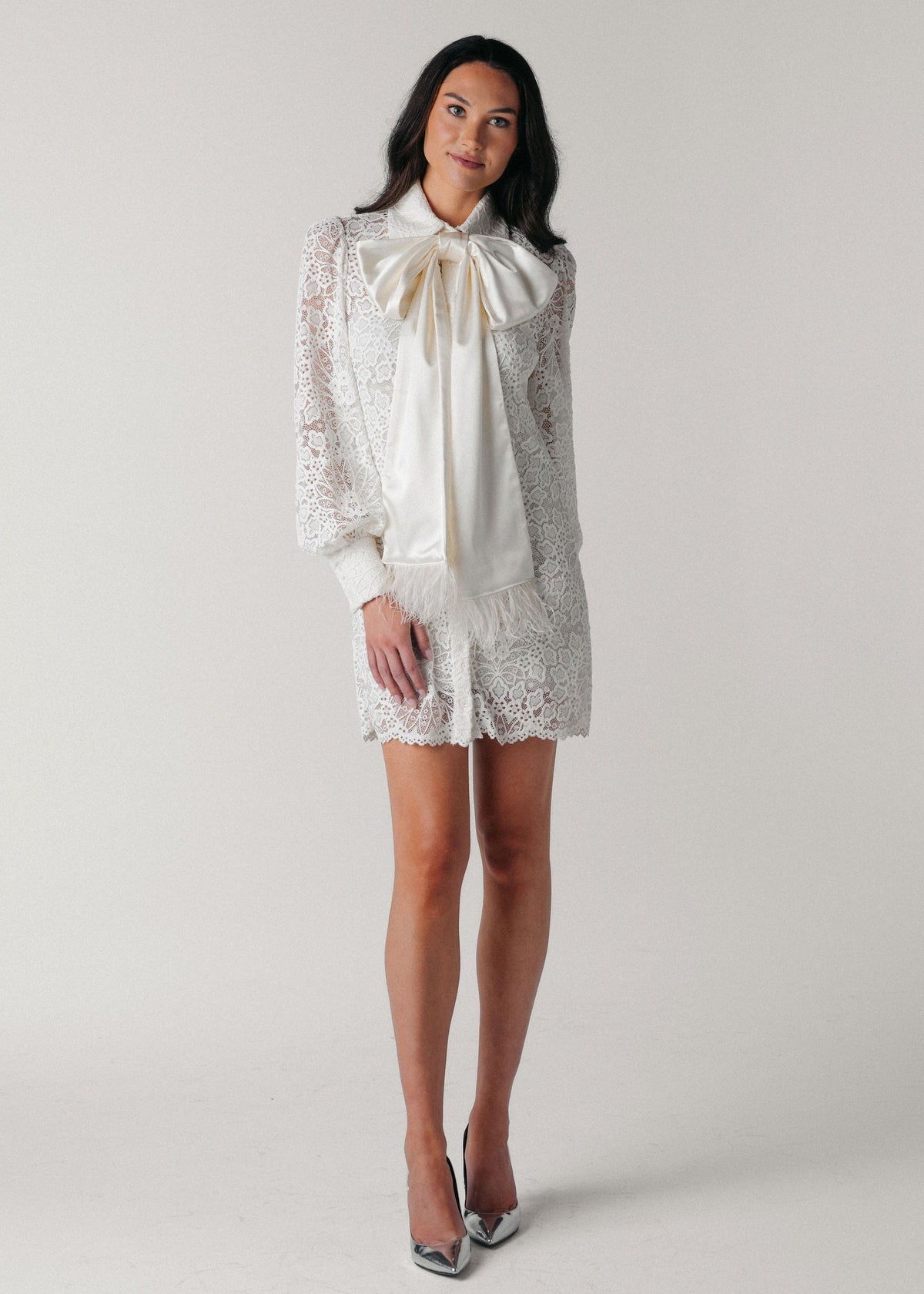 Samantha Wood Fashion Designer Bridal Era Collection Charlotte White Lace Shirt Dress on Model Front With Satin Ostrich Feather Bow